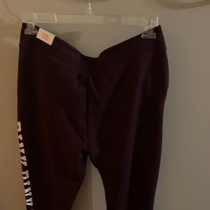 Pink branded sweatpants.